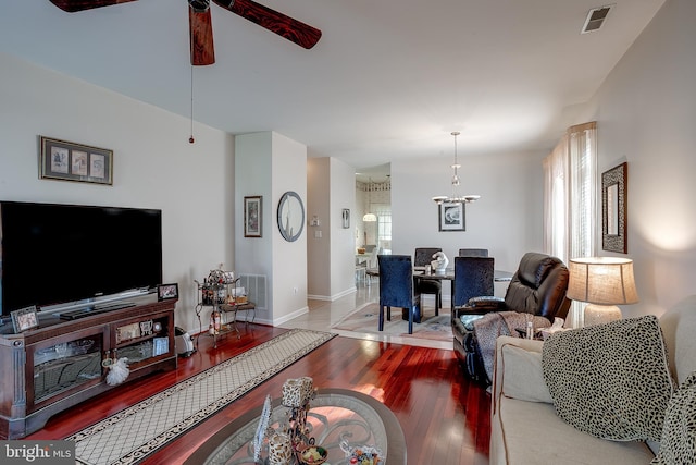 4 Montclair Ave, Berlin, NJ 08009 - living room with ceiling fan, wood finished floors, a chandelier, and baseboards