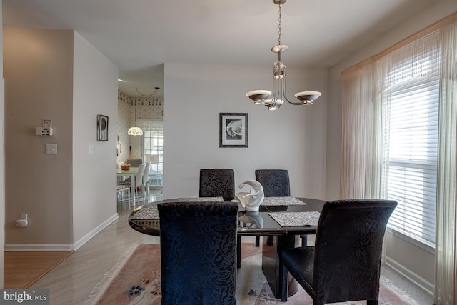4 Montclair Ave, Berlin, NJ 08009 - dining area featuring a chandelier, wood finished floors, and baseboards