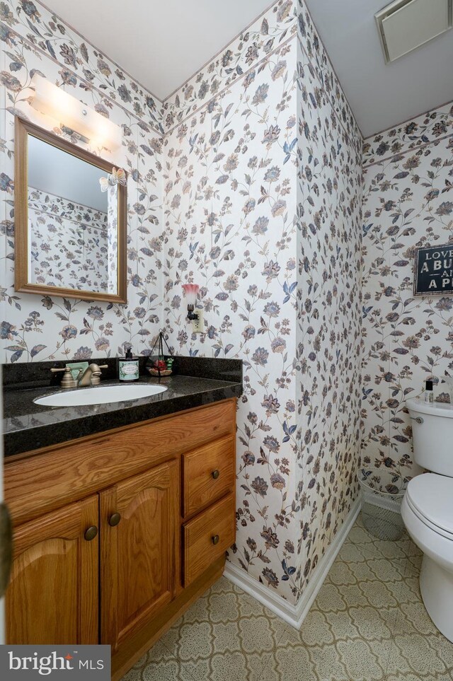 2 Wicklow Dr, Tabernacle, NJ 08088 - bathroom featuring wallpapered walls, toilet, vanity, baseboards, and tile patterned floors