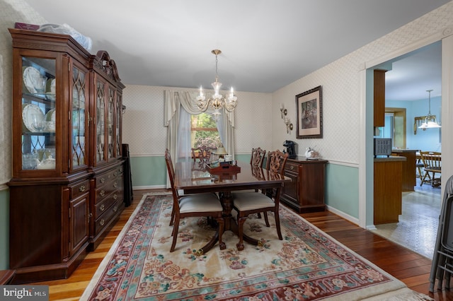 2 Wicklow Dr, Tabernacle, NJ 08088 - dining area with wallpapered walls, a chandelier, light wood-style floors, wainscoting, and baseboards