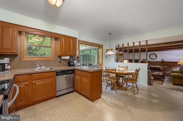 2 Wicklow Dr, Tabernacle, NJ 08088 - kitchen featuring stainless steel appliances, a sink, decorative light fixtures, brown cabinetry, and a peninsula