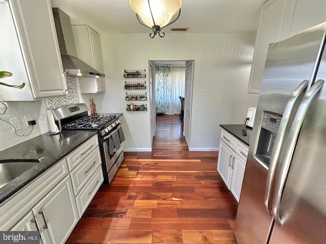 2817 Comly Rd, Philadelphia, PA 19154 - kitchen featuring appliances with stainless steel finishes, wall chimney exhaust hood, backsplash, dark wood-type flooring, and white cabinetry