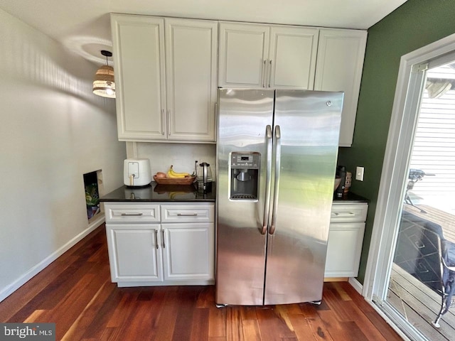 2817 Comly Rd, Philadelphia, PA 19154 - kitchen featuring stainless steel fridge, dark countertops, dark wood-type flooring, white cabinets, and baseboards