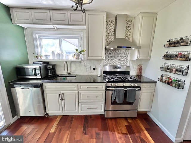 2817 Comly Rd, Philadelphia, PA 19154 - kitchen featuring appliances with stainless steel finishes, wall chimney exhaust hood, a sink, and dark countertops
