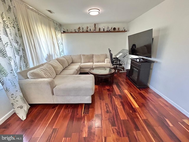 2817 Comly Rd, Philadelphia, PA 19154 - living area featuring dark wood-type flooring, baseboards, and a fireplace