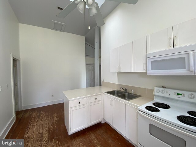 5110 Berclair Plantation Ln, Fredericksburg, VA 22408 - kitchen featuring white appliances, dark wood-style floors, a sink, and a peninsula