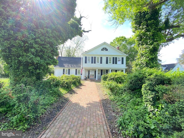 5110 Berclair Plantation Ln, Fredericksburg, VA 22408 - greek revival house featuring a porch and a chimney