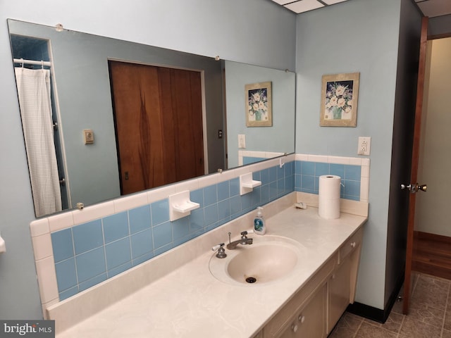 full bathroom with vanity, tile patterned flooring, and curtained shower