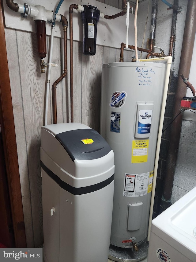utility room with water heater