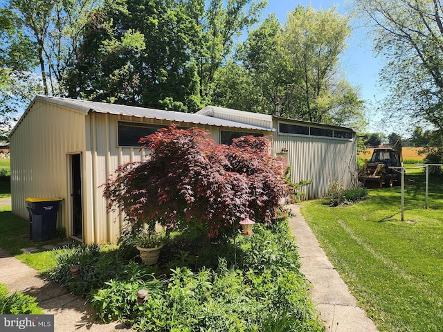 view of side of home featuring a lawn