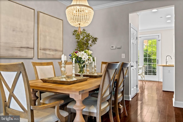 507 Governors Ct, Philadelphia, PA 19146 - dining area with ornamental molding, a chandelier, dark wood finished floors, and baseboards