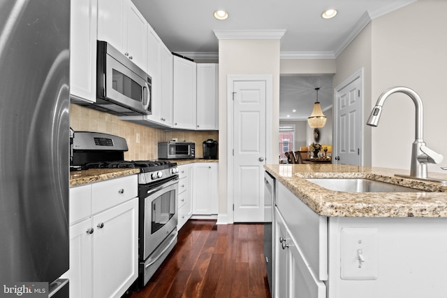 507 Governors Ct, Philadelphia, PA 19146 - kitchen with appliances with stainless steel finishes, a sink, dark wood-style flooring, recessed lighting, and crown molding