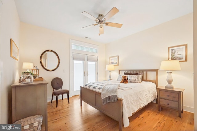 bedroom with light wood-type flooring, baseboards, french doors, and ceiling fan