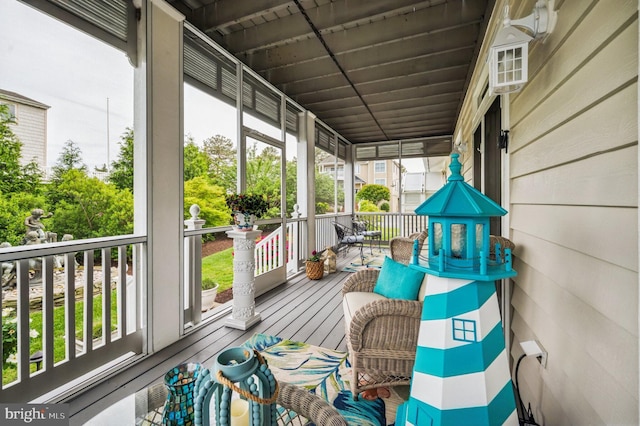 sunroom / solarium featuring healthy amount of natural light
