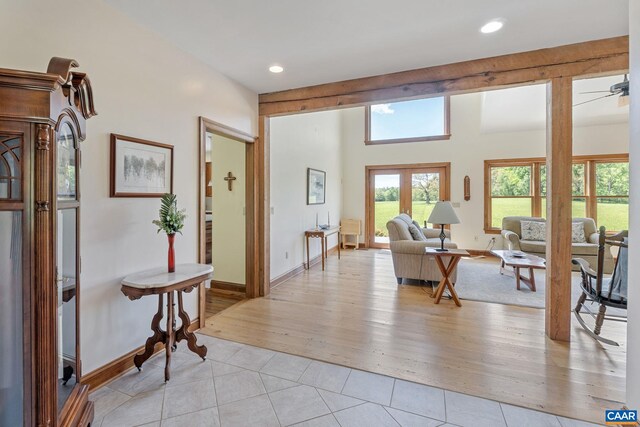 6670 Scottsville Rd, Scottsville, VA 24590 - living room with recessed lighting, light tile patterned floors, baseboards, and french doors