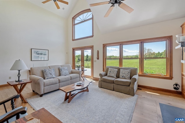 6670 Scottsville Rd, Scottsville, VA 24590 - living room featuring ceiling fan, light wood-style flooring, high vaulted ceiling, baseboards, and french doors
