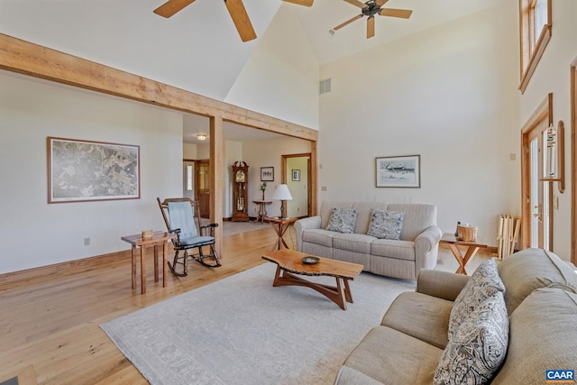 6670 Scottsville Rd, Scottsville, VA 24590 - living room with ceiling fan, high vaulted ceiling, wood finished floors, baseboards, and radiator heating unit