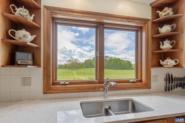 6670 Scottsville Rd, Scottsville, VA 24590 - kitchen featuring open shelves, a sink, light stone countertops, and decorative backsplash