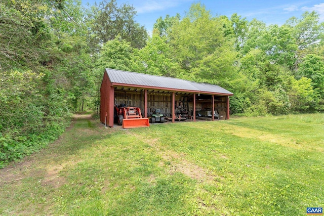 6670 Scottsville Rd, Scottsville, VA 24590 - view of pole building with a lawn and a forest view