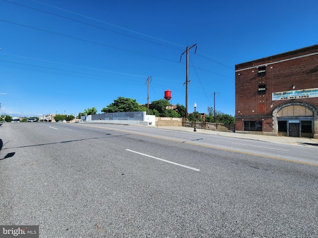 2127 Edmondson Ave, Baltimore, MD 21223 - view of asphalt street with curbs, street lights, and sidewalks