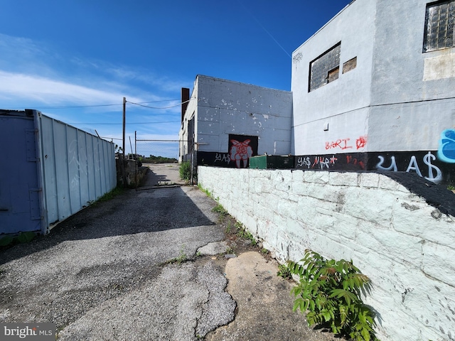 2127 Edmondson Ave, Baltimore, MD 21223 - view of asphalt driveway with a gated entry