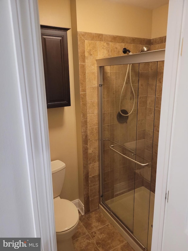 13 Amherst Ct, Bordentown, NJ 08505 - full bathroom featuring a shower stall, toilet, tile patterned floors, and baseboards