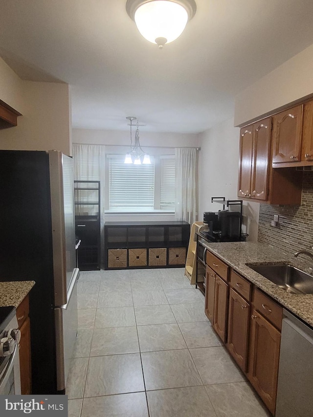 13 Amherst Ct, Bordentown, NJ 08505 - kitchen with appliances with stainless steel finishes, a sink, tasteful backsplash, light tile patterned floors, and light stone counters