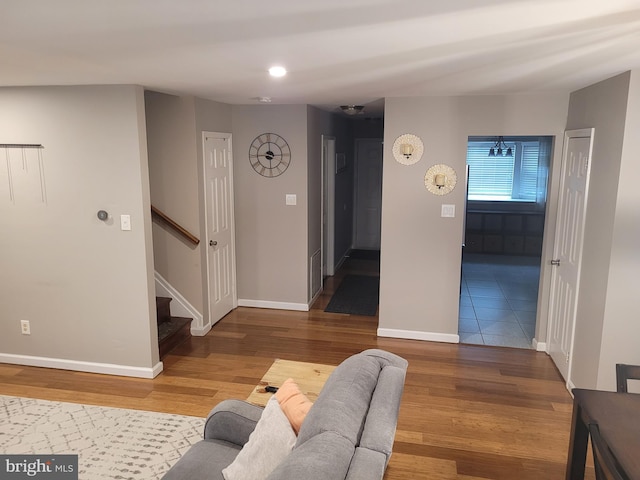 13 Amherst Ct, Bordentown, NJ 08505 - living room with wood finished floors, baseboards, and stairway