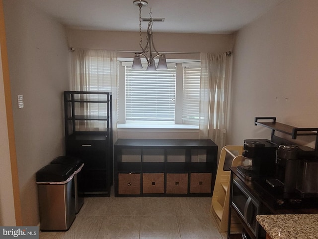 13 Amherst Ct, Bordentown, NJ 08505 - dining area with light tile patterned flooring and a chandelier