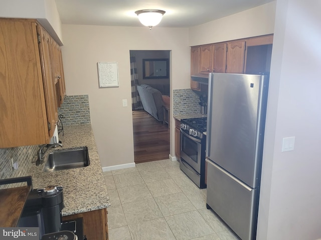 13 Amherst Ct, Bordentown, NJ 08505 - kitchen featuring stainless steel appliances, a sink, decorative backsplash, light stone counters, and range hood