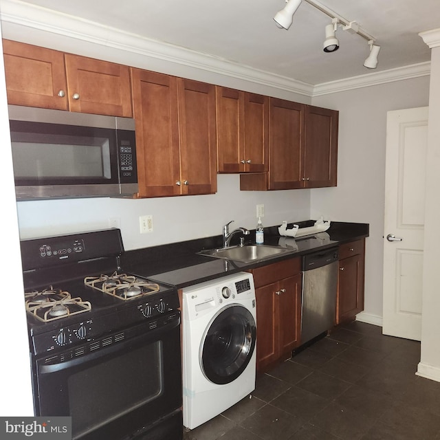 3105 Naylor Rd SE Unit 302, Washington, DC 20020 - kitchen featuring appliances with stainless steel finishes, washer / dryer, a sink, crown molding, and rail lighting
