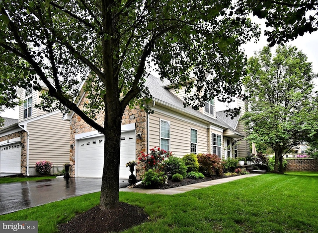 15 Eagle Rd, Phoenixville, PA 19460 - view of front of home with stone siding, driveway, a front yard, a garage, and a shingled roof