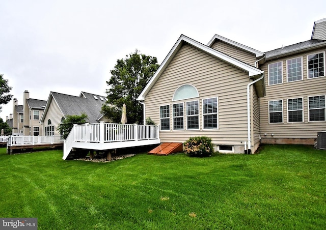 15 Eagle Rd, Phoenixville, PA 19460 - back of property featuring a deck, a lawn, and cooling unit