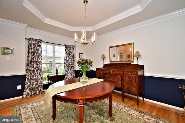 15 Eagle Rd, Phoenixville, PA 19460 - dining area with wood finished floors, a chandelier, a raised ceiling, ornamental molding, and baseboards