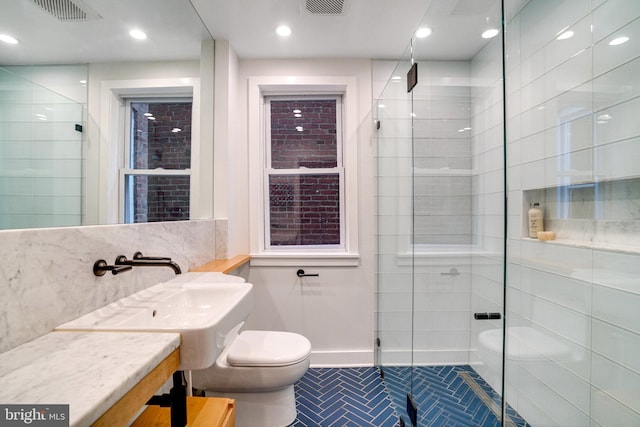 bathroom with toilet, a shower stall, tile patterned floors, baseboards, and recessed lighting