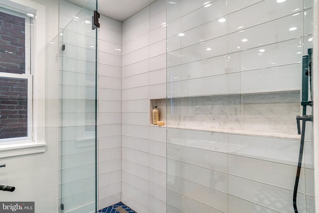 full bath featuring tiled shower