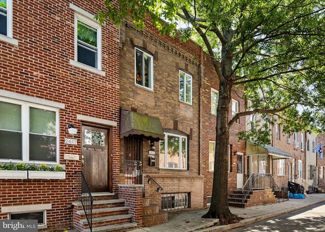 view of front of home with brick siding