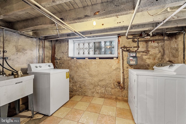washroom with washing machine and dryer