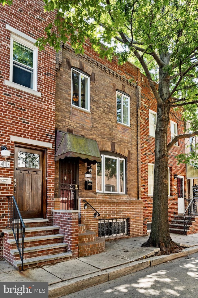 view of front of property with brick siding and entry steps