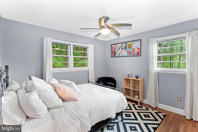 3608 Whispering Ln, Falls Church, VA 22041 - bedroom with multiple windows, wood finished floors, baseboards, and ceiling fan