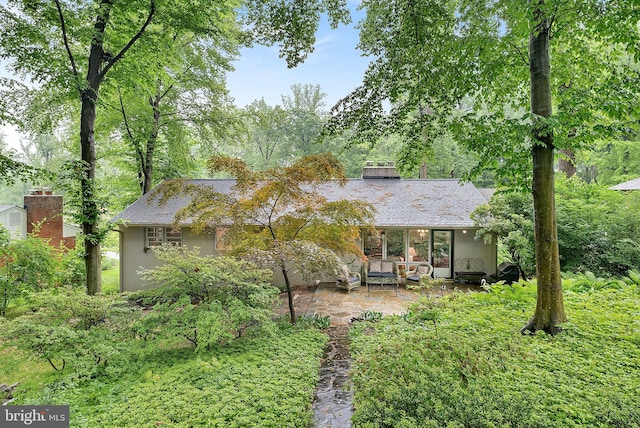 3608 Whispering Ln, Falls Church, VA 22041 - rear view of house with a patio and roof with shingles