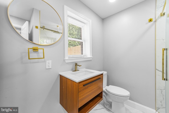 1615 Fillmore St, Philadelphia, PA 19124 - bathroom with marble look tile flooring, toilet, baseboards, vanity, and a marble finish shower