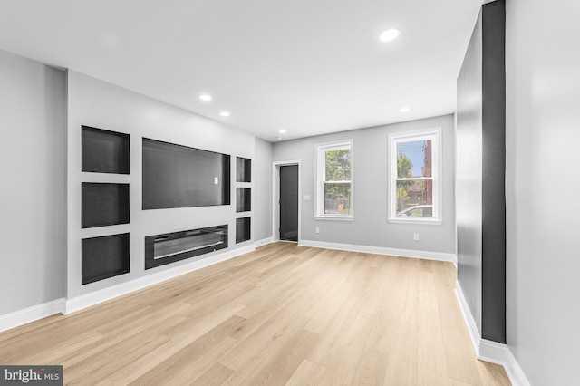 1615 Fillmore St, Philadelphia, PA 19124 - unfurnished living room with light wood-style flooring, baseboards, recessed lighting, and built in shelves