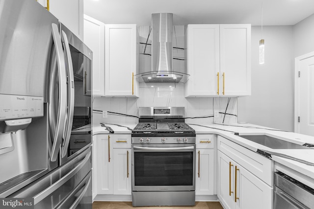 1615 Fillmore St, Philadelphia, PA 19124 - kitchen with stainless steel appliances, exhaust hood, white cabinets, and light countertops