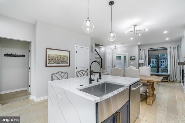 603 N Alfred St, Alexandria, VA 22314 - kitchen featuring a sink, light wood-style flooring, hanging light fixtures, baseboards, and recessed lighting