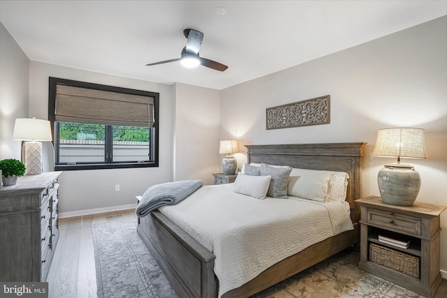 603 N Alfred St, Alexandria, VA 22314 - bedroom with baseboards, wood finished floors, and ceiling fan