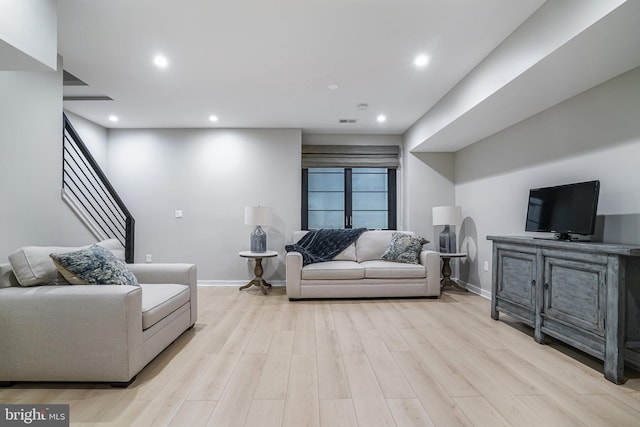 603 N Alfred St, Alexandria, VA 22314 - living room featuring light wood-style flooring, recessed lighting, baseboards, and stairway