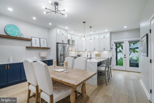 603 N Alfred St, Alexandria, VA 22314 - dining space with a chandelier, light wood-type flooring, and recessed lighting