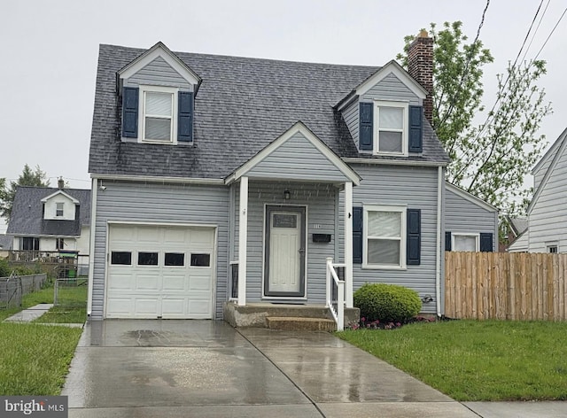 new england style home with an attached garage, driveway, a chimney, and roof with shingles