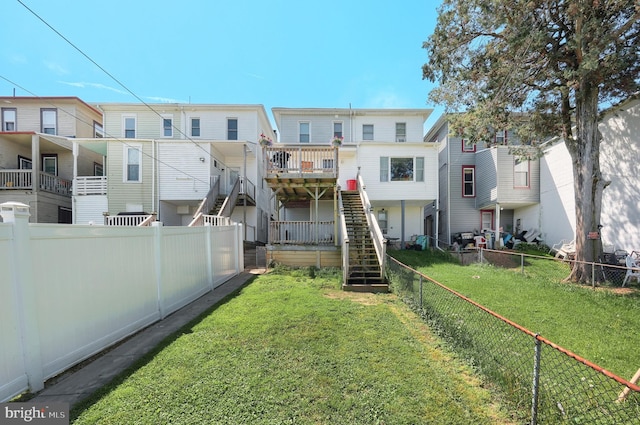 rear view of property with stairs